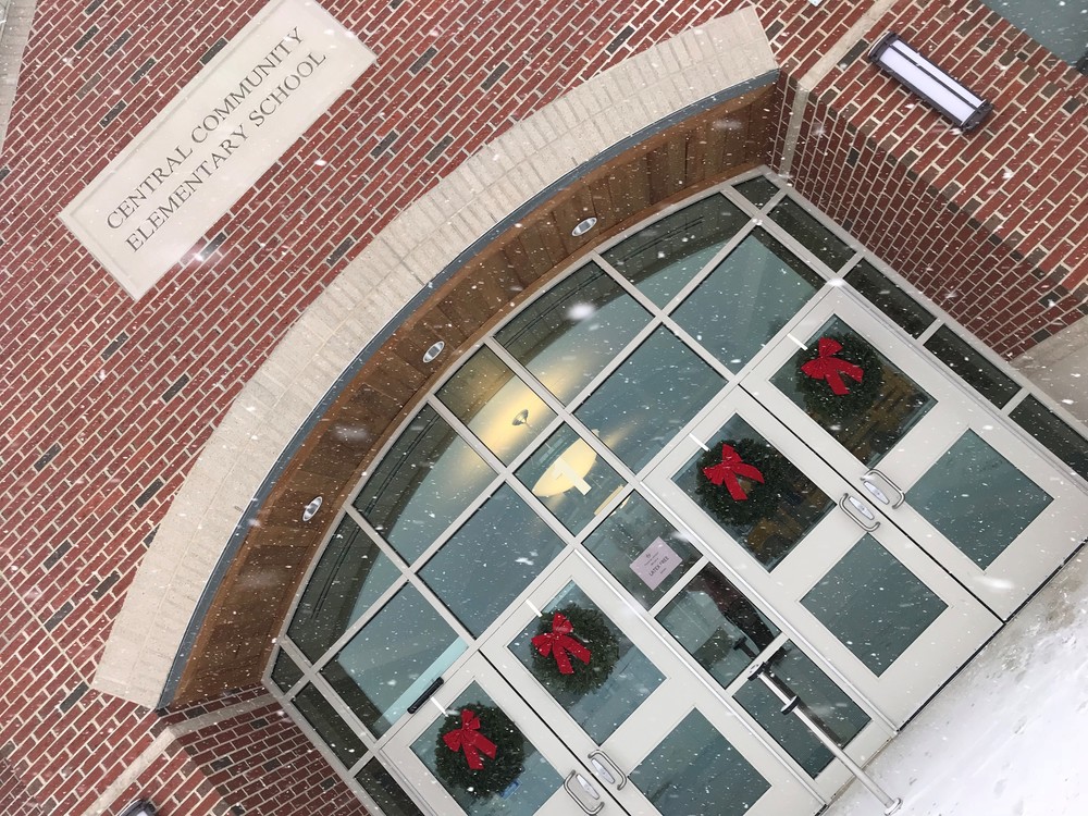 Front doors of the school building with wreaths.